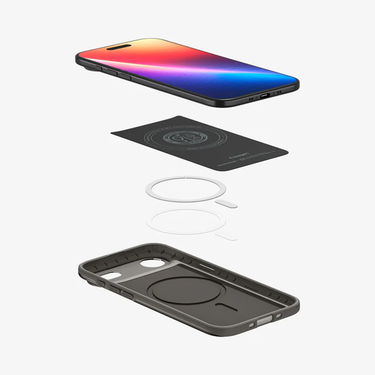 Een geëxplodeerde weergave van een telefoon en accessoires. Een telefoon staat boven een magneetkaart, twee witte ringen en een telefoonhoesje.