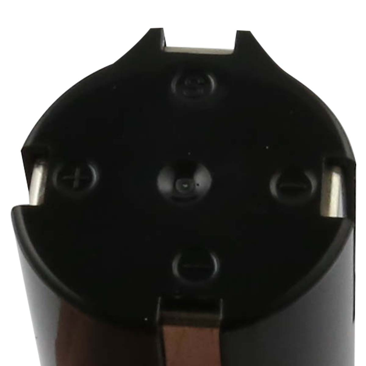 Primo piano di un'estremità di un dispositivo nero. Include un simbolo più, perni metallici e un design a semicerchio.