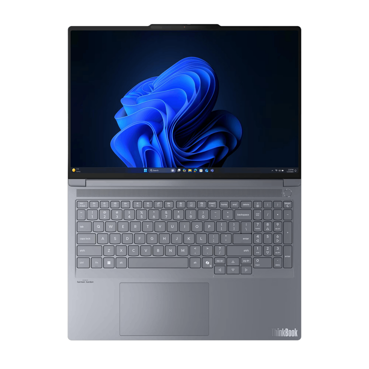 Un portátil gris con un fondo de escritorio azul oscuro. El teclado es visible y la pantalla muestra un diseño abstracto azul.