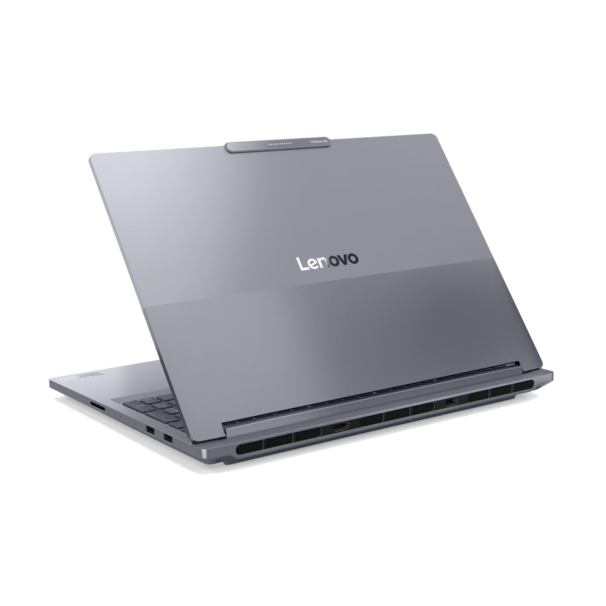 Una computadora portátil Lenovo gris está ligeramente abierta, mostrando el teclado. El logotipo de Lenovo es visible. La portátil está sobre un fondo negro.