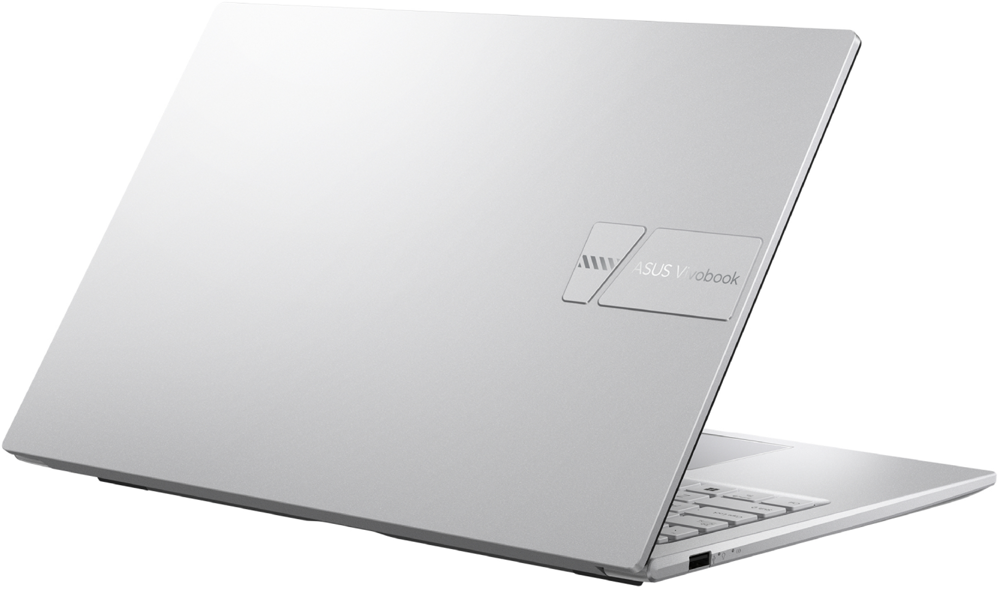 Una computadora portátil ASUS Vivobook plateada se muestra en ángulo, abierta. La tapa tiene el logotipo de ASUS y el teclado es visible.