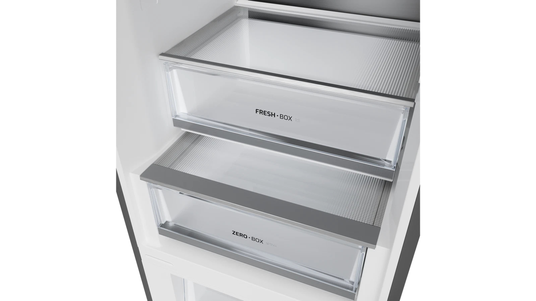 Dentro de un refrigerador, se ven dos cajones transparentes con las etiquetas 'FRESH BOX' y 'ZERO BOX', con bordes plateados.