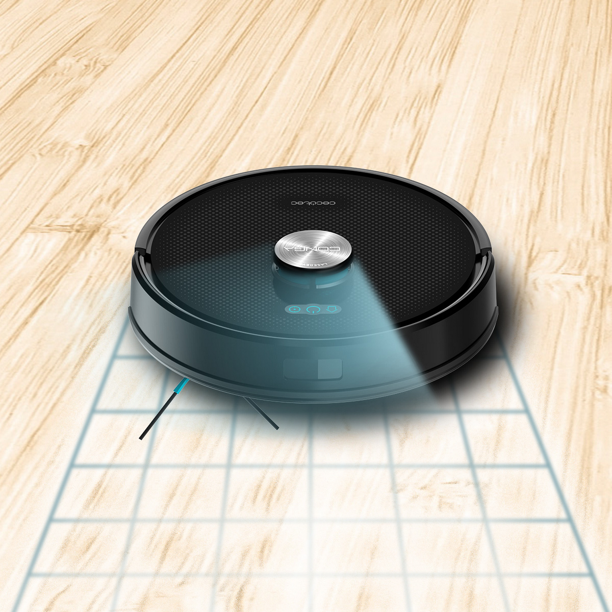 Un aspirapolvere robot nero su un pavimento in legno. Emette una luce blu e ha linee di percorso di pulizia visibili.