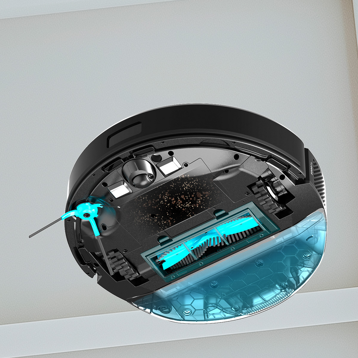 Un aspirapolvere robot nero visto dal basso, che mostra spazzole e vano polvere. Punti blu sulle spazzole e altre parti.