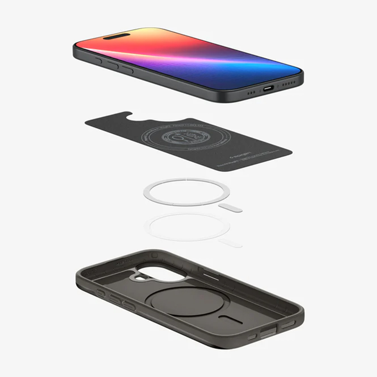 Vista esplosa di un telefono, una custodia, un anello magnetico e una scheda, tutto in grigio e nero, su sfondo bianco.