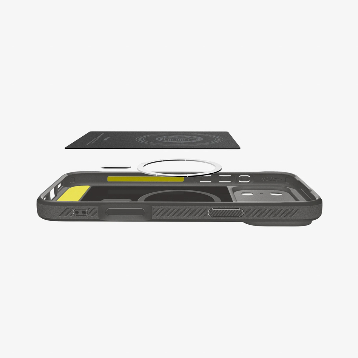 Vue éclatée d'une coque de téléphone. Un étui noir, un aimant circulaire et un rectangle noir sont visibles.