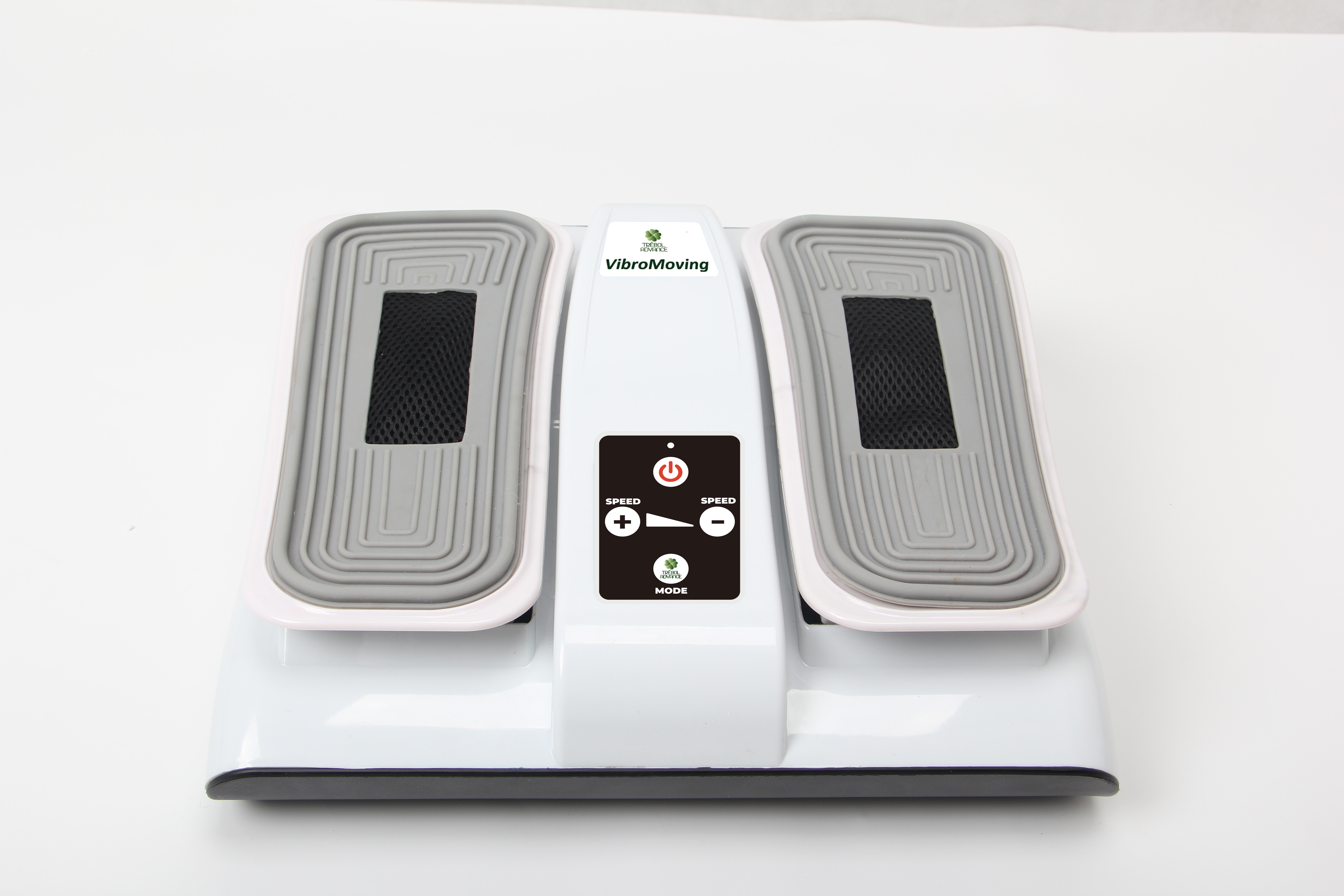 Máquina VibroMoving blanca con almohadillas grises y panel de control. Botones negros de encendido y modo.