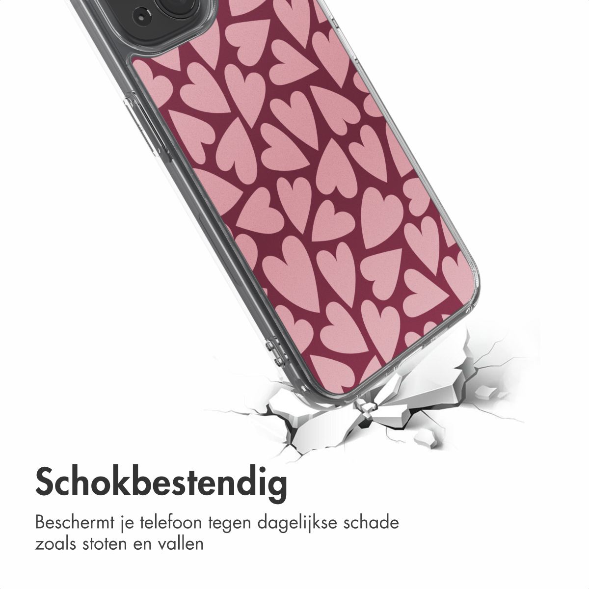 Een telefoonhoesje met een roze hartjespatroon valt en barst het oppervlak eronder. De hoes is transparant.