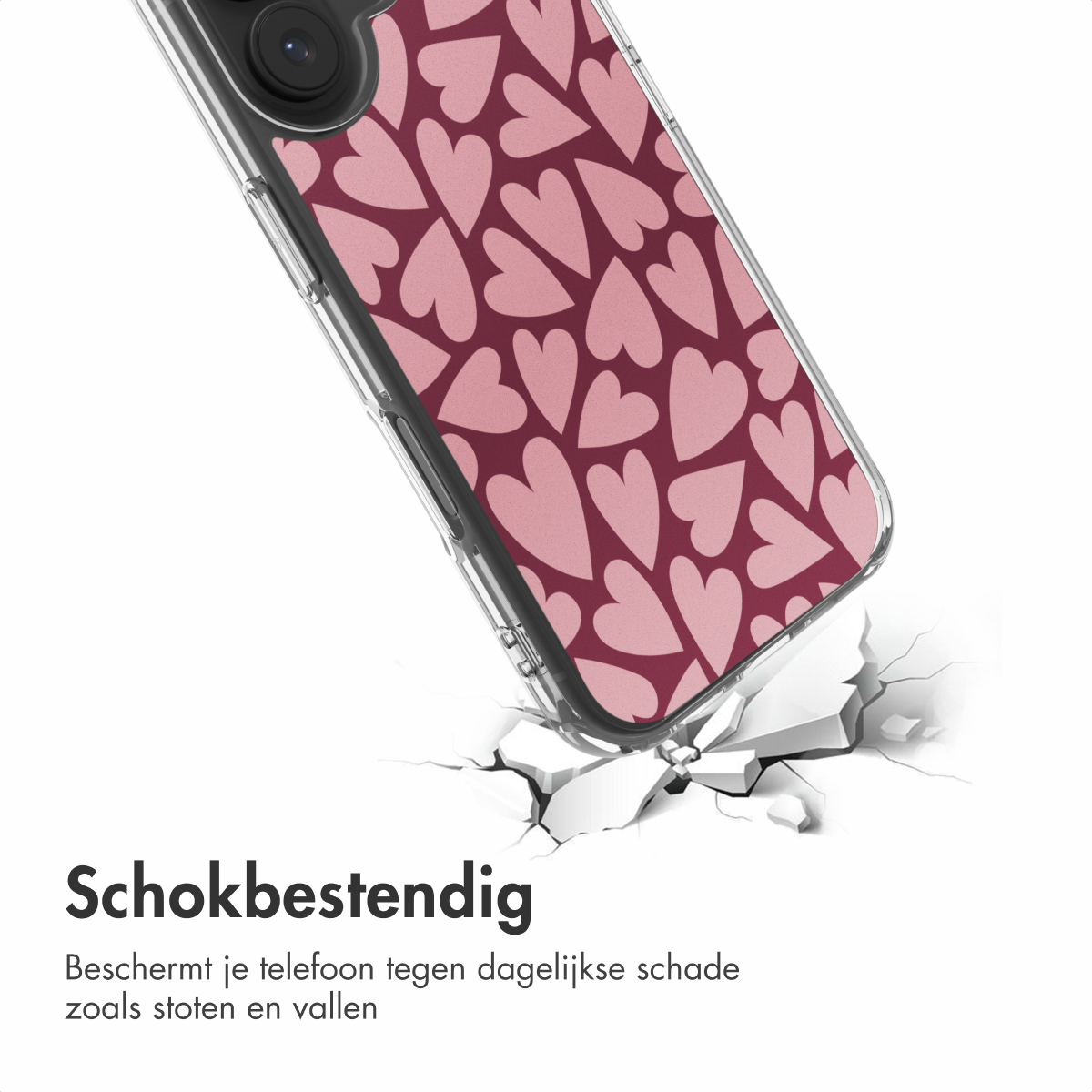 Een telefoonhoesje met roze hartjes op een bordeauxrode achtergrond breekt een oppervlak. De woorden 'Schokbestendig' zijn zichtbaar.