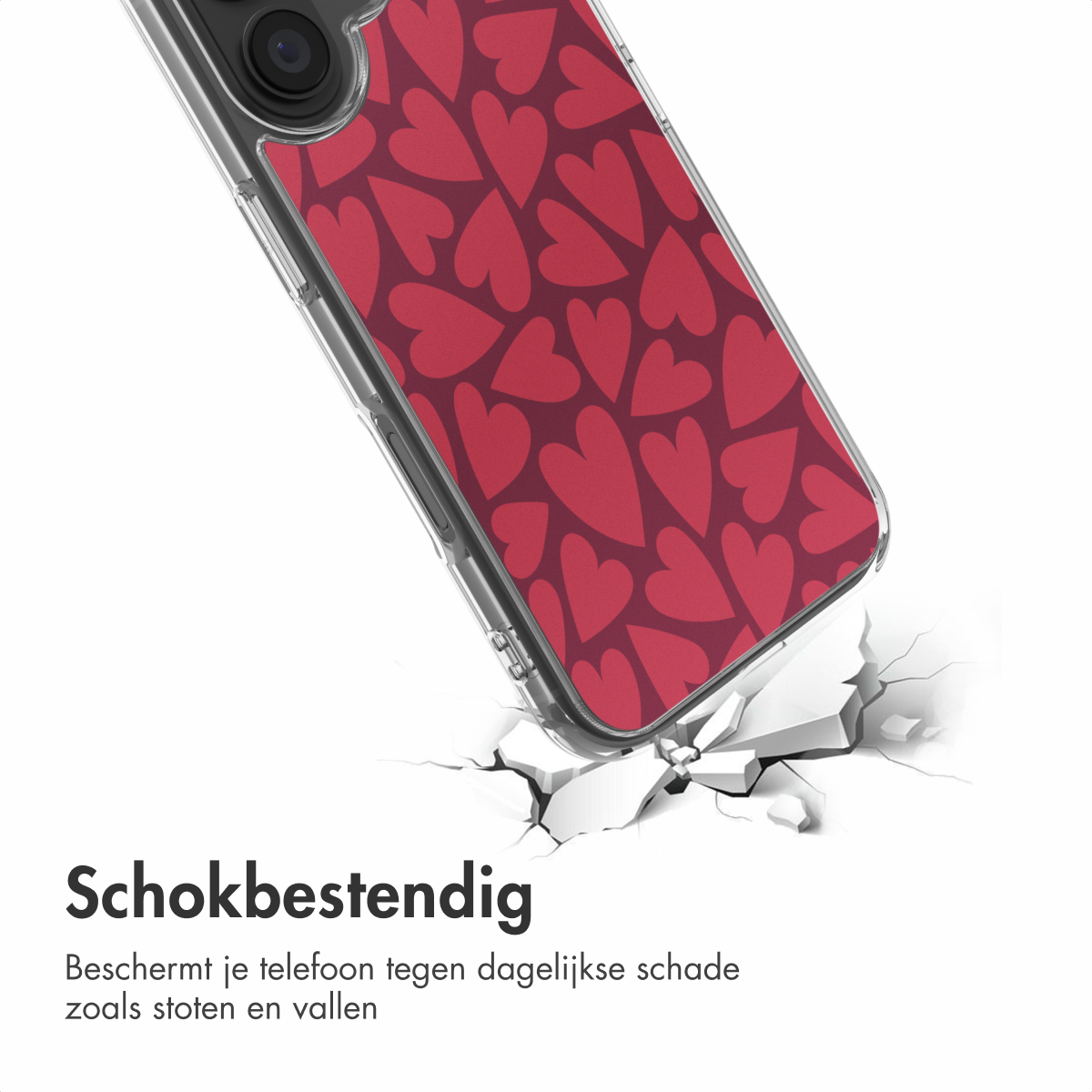 Een telefoonhoesje met rood hartjesontwerp breekt een wit oppervlak en toont zijn schokbestendige functie.