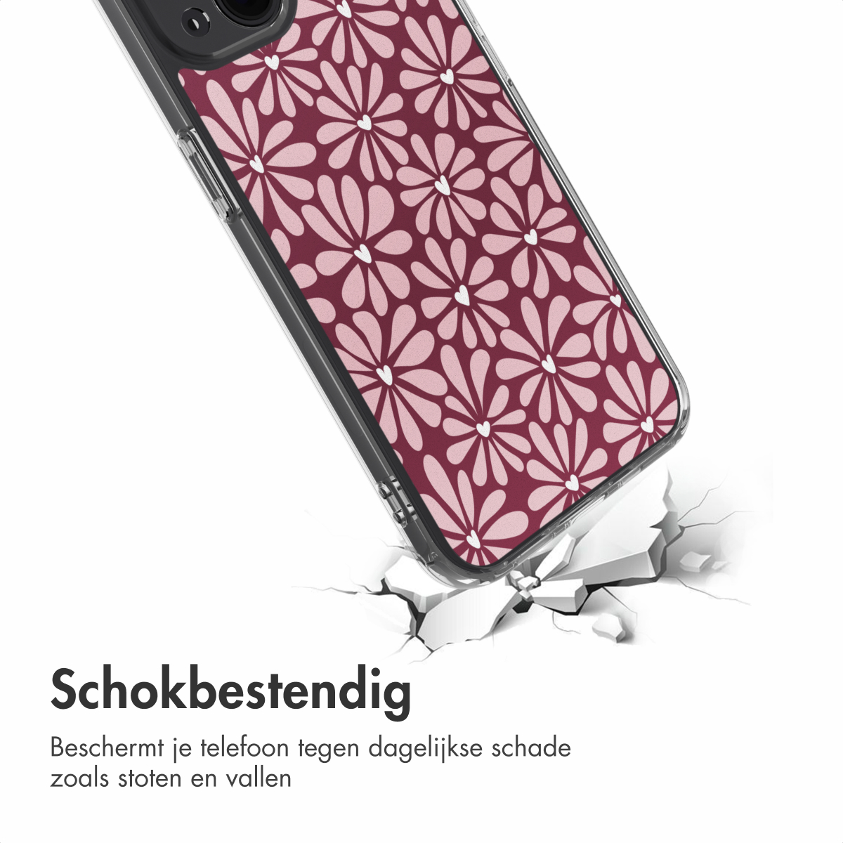 Un étui de téléphone avec un motif floral est en train de fissurer une surface. L'étui a un fond bordeaux avec des fleurs roses.
