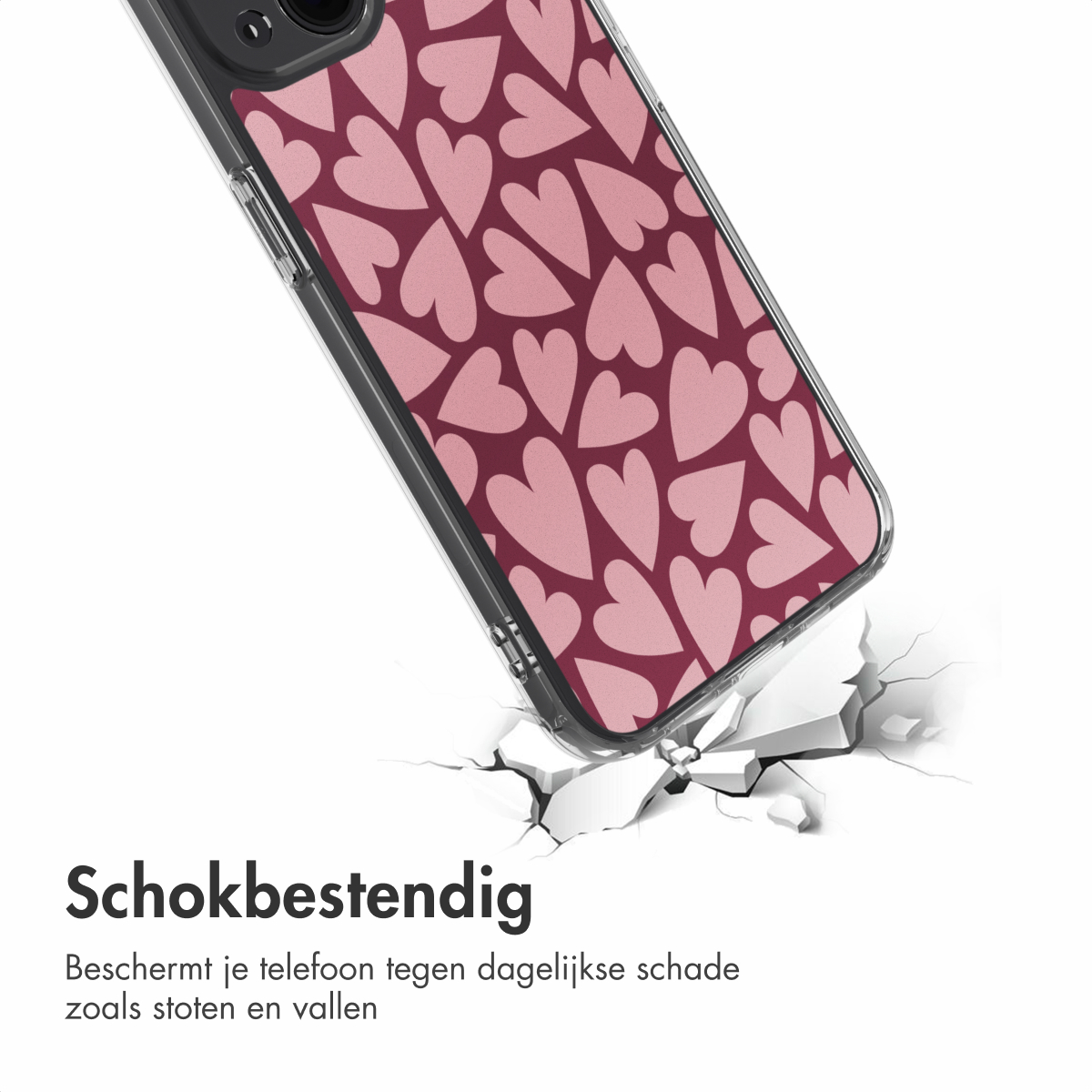 Una custodia per telefono con cuori rosa su sfondo bordeaux. La custodia sta rompendo una superficie bianca. Testo: 'Antishock'.