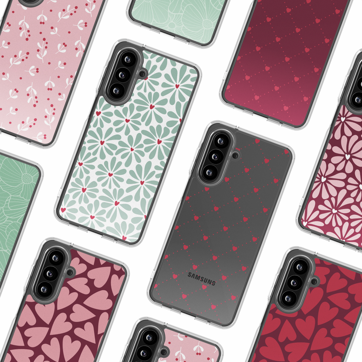 Verschillende smartphones met diverse bloemen- en hartpatroonhoesjes zijn gerangschikt op een wit oppervlak. De hoesjes tonen verschillende kleuren en ontwerpen.