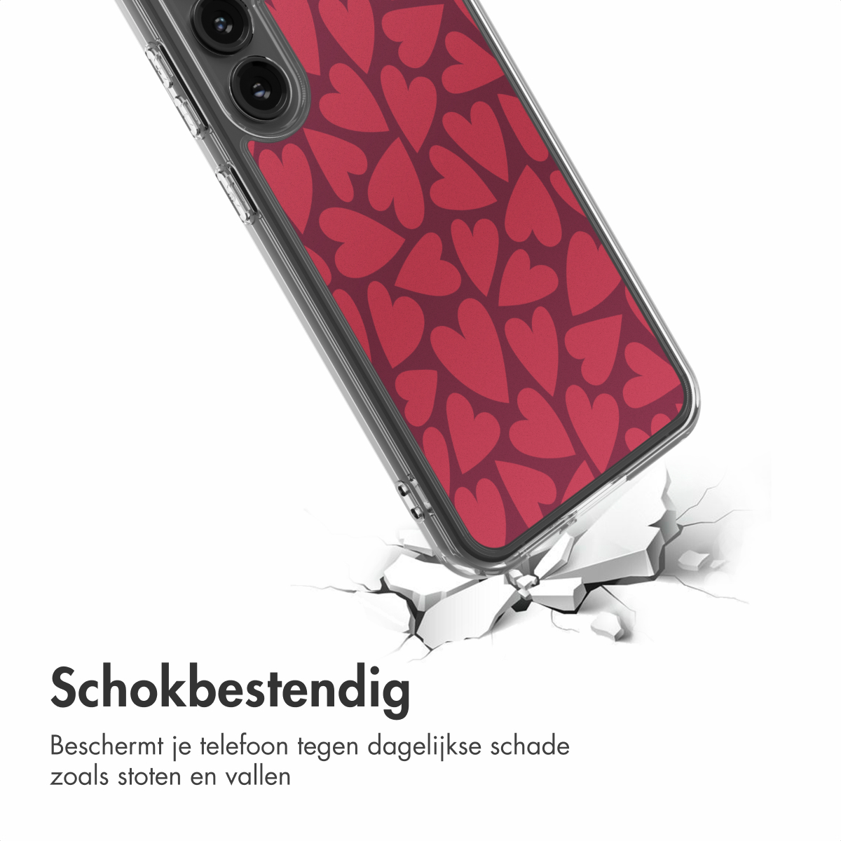 Een telefoonhoesje met hartjespatroon valt en breekt de grond. De hoes is transparant, de hartjes zijn rood op een donkerrode achtergrond.