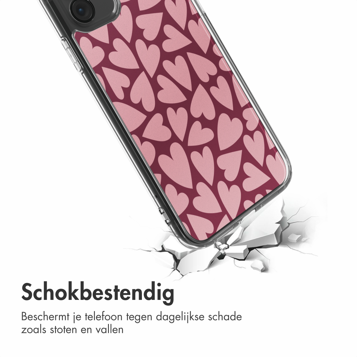 Custodia per telefono con cuori rosa su sfondo rosso scuro, su superficie bianca crepata. Testo: Resistente agli urti.