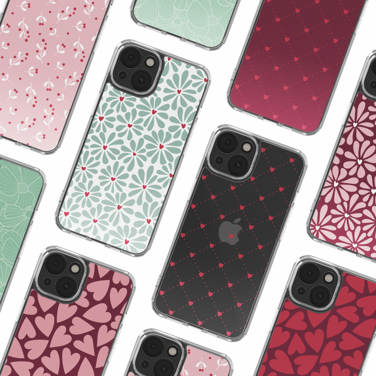Varie custodie per iPhone con motivi floreali, a cuore e a pois. Le custodie sono rosa, rosse, nere e verde menta, con bordi trasparenti.