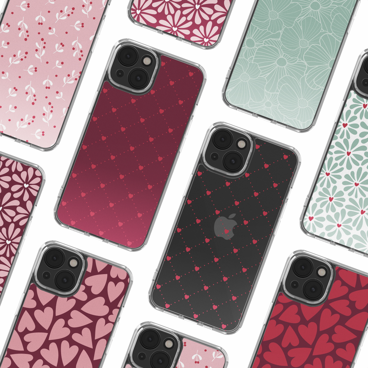 Meerdere telefoonhoesjes met verschillende ontwerpen zoals harten, bloemen en bladeren. De hoesjes zijn roze, rood en groen van kleur, met een witte achtergrond.