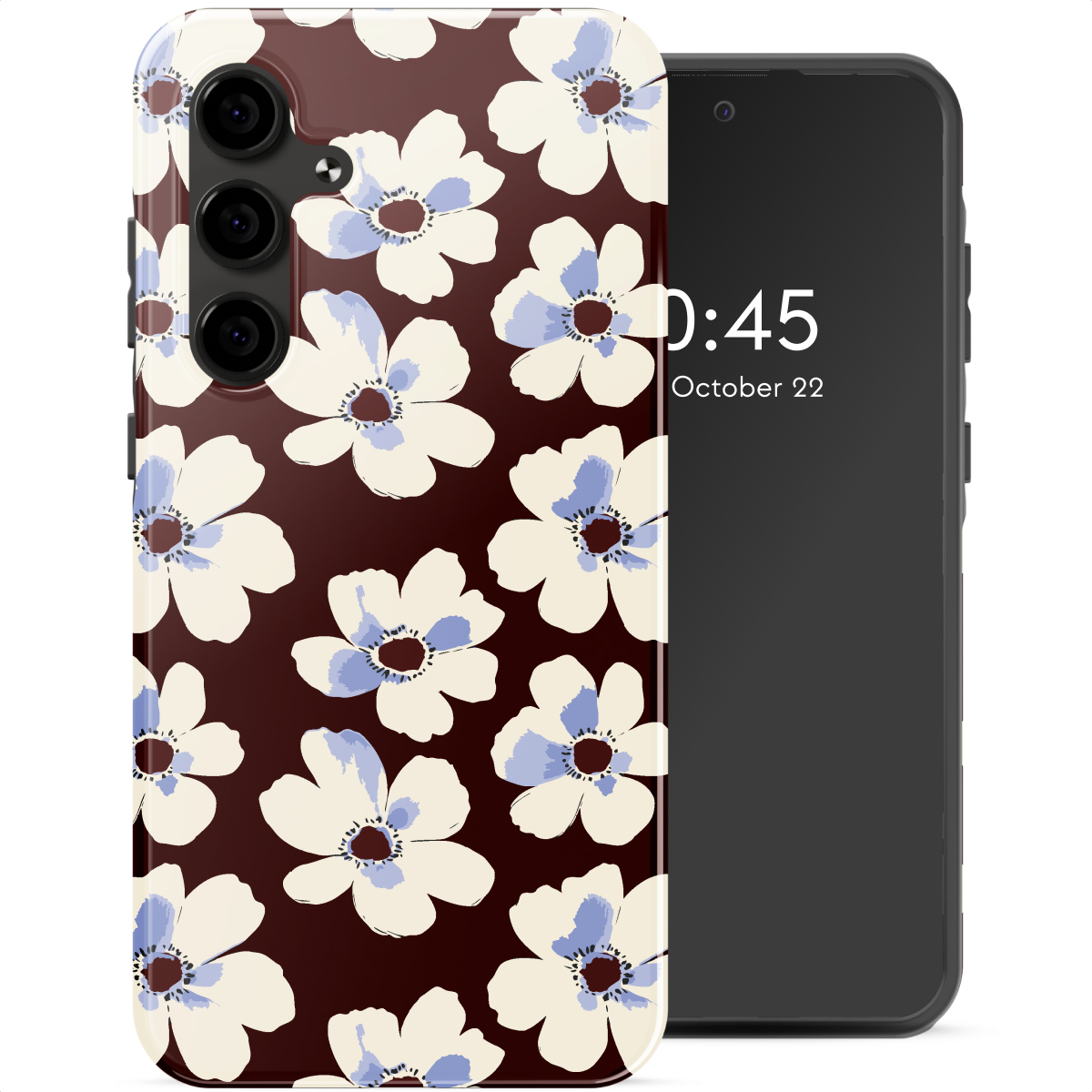 Un téléphone avec une coque florale présentant des fleurs blanches à centres bleus sur fond marron. Un téléphone noir affiche l'heure.
