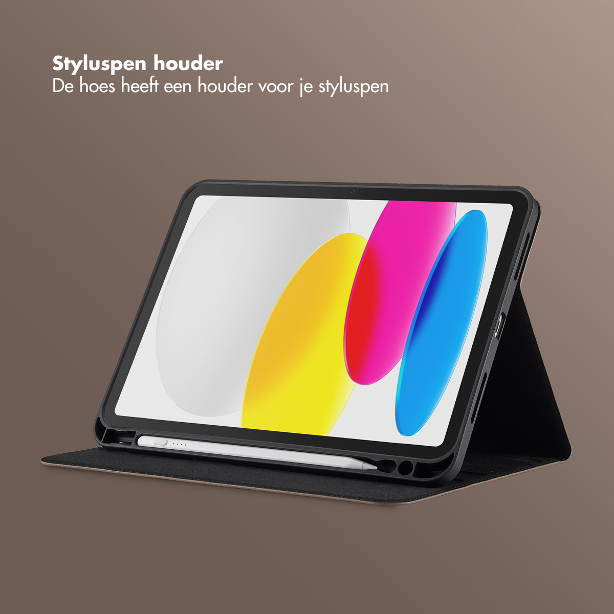 An open tablet with a stylus pen holder. The screen shows colorful shapes. The tablet is in a black case on a brown surface.