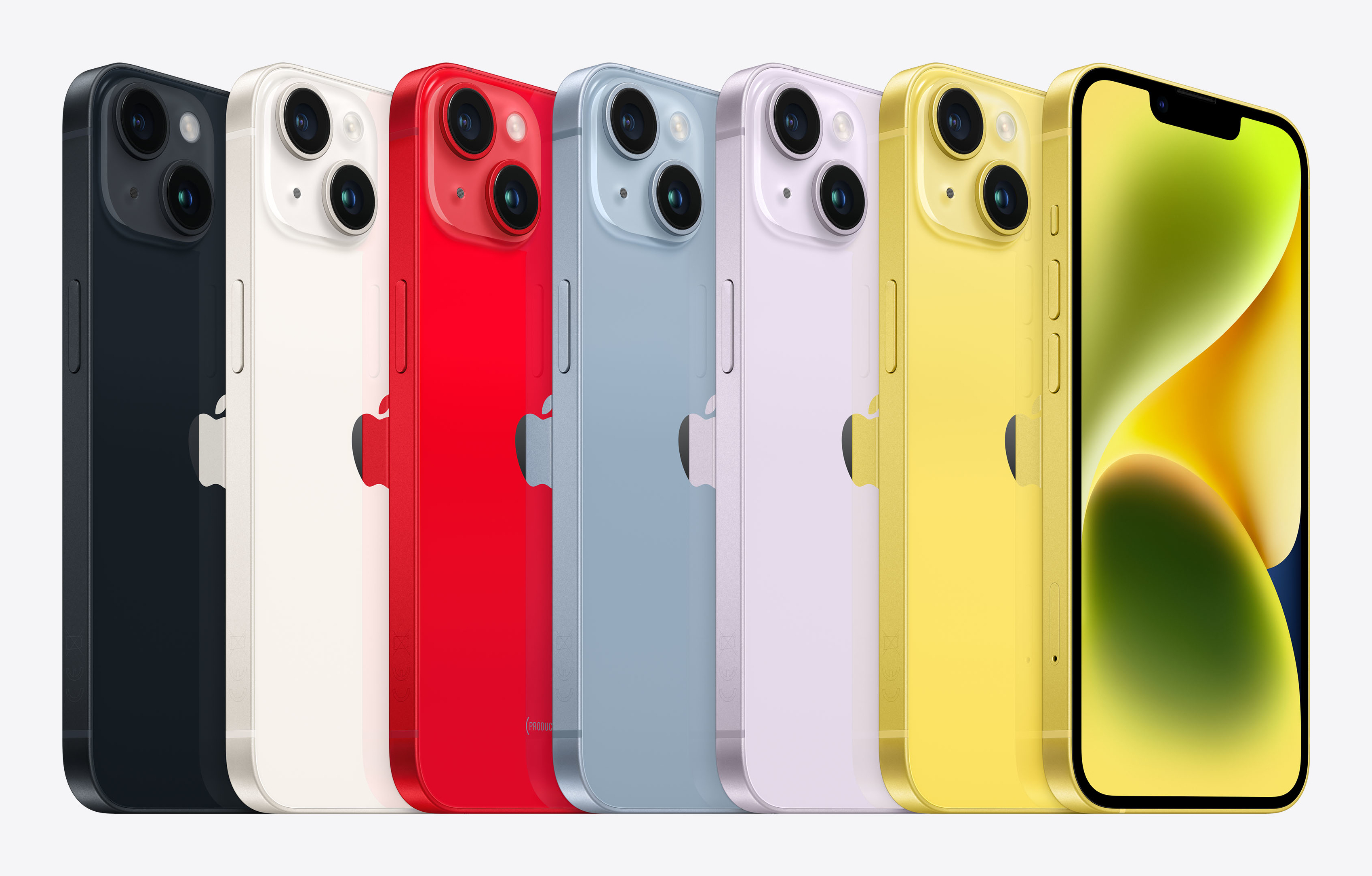 Rząd kolorowych iPhone'ów. Kolory to czarny, biały, czerwony, niebieski, fioletowy, żółty, a ekran ostatniego jest włączony.