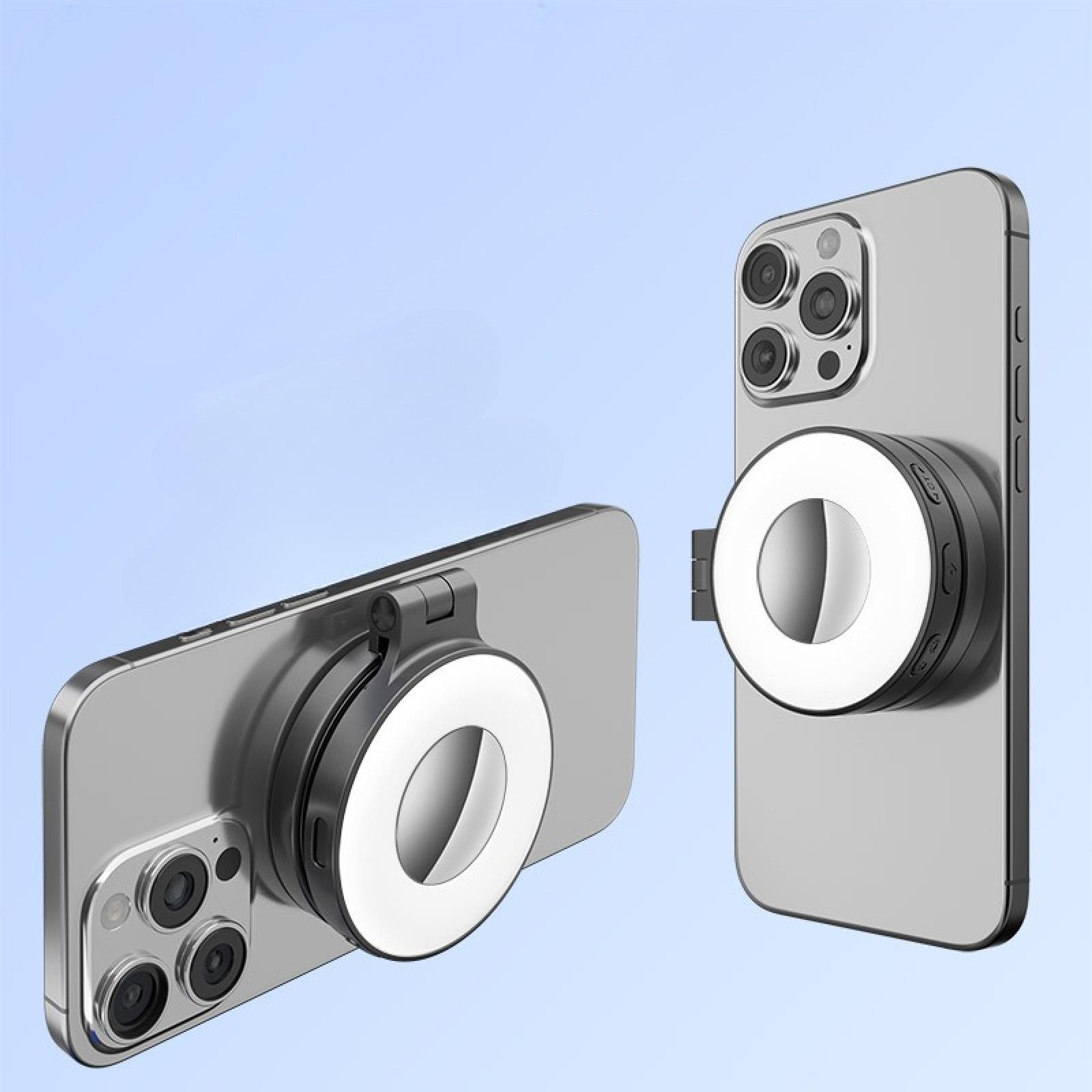 Zwei Smartphones mit angebrachten Ringleuchten. Die Telefone sind silberfarben, die Lichter weiß, vor blauem Hintergrund.
