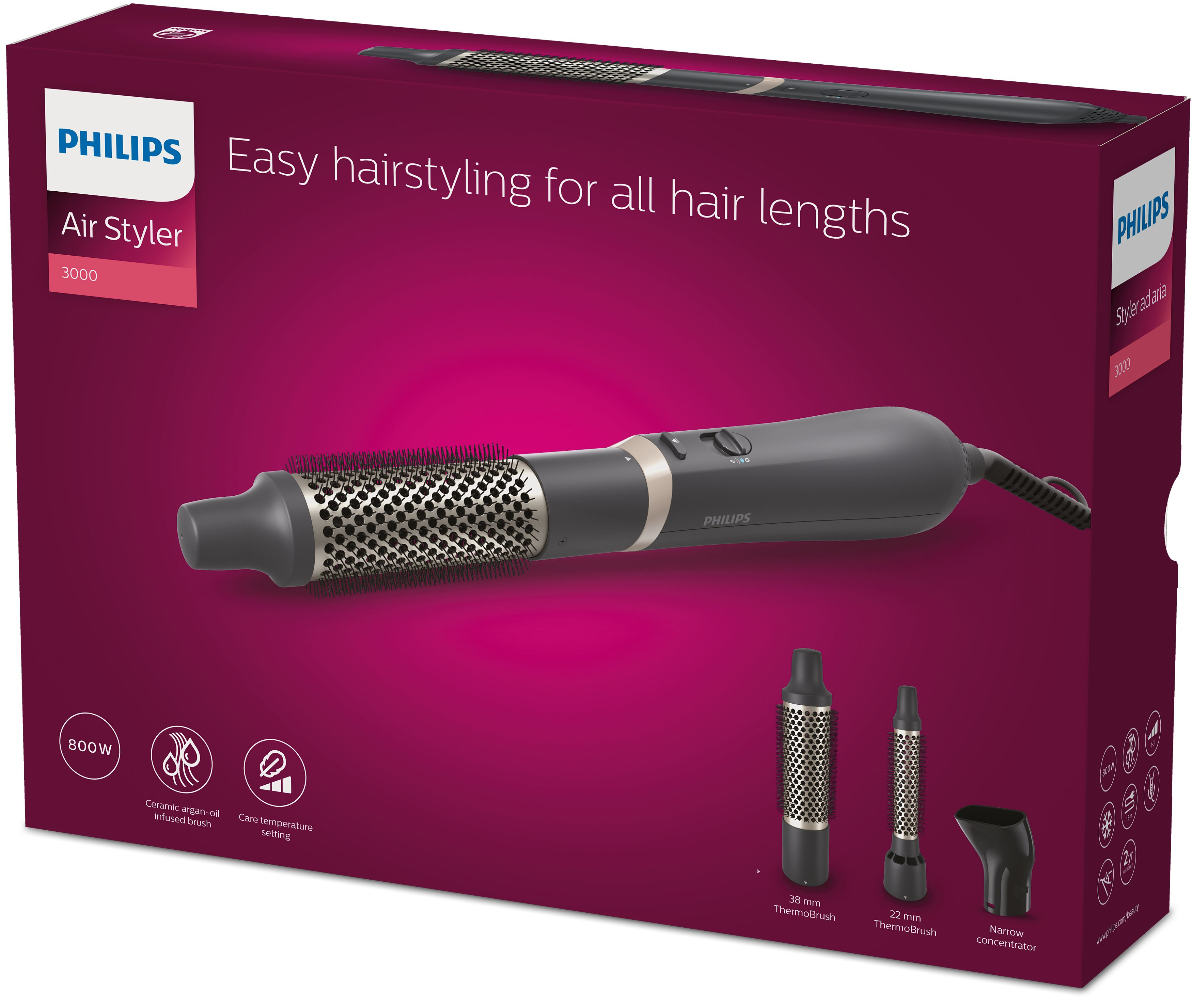 Scatola Philips Air Styler. Ha un'arricciacapelli e accessori. Lo sfondo è magenta scuro.