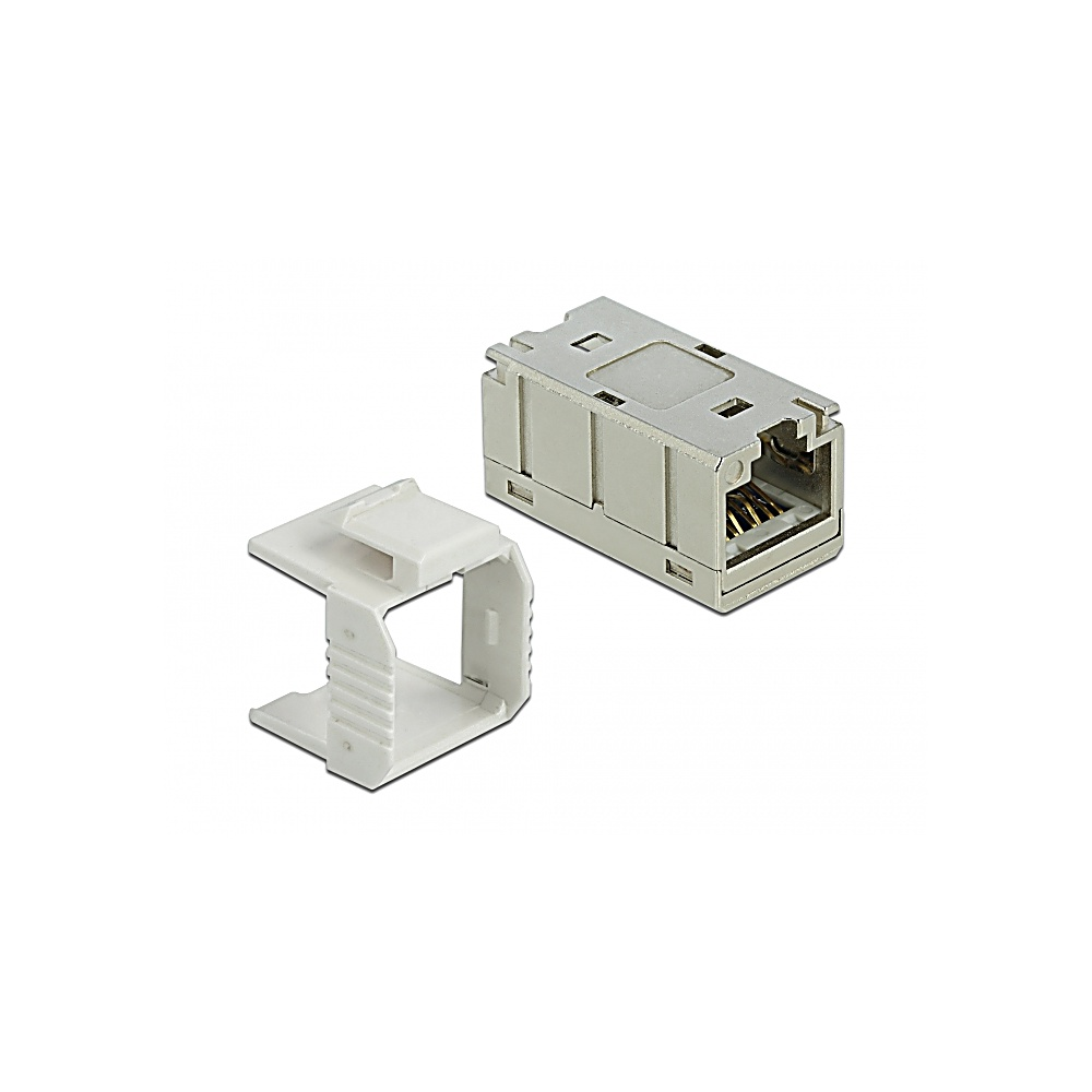 Un conector RJ45 gris y una cubierta blanca sobre un fondo blanco. El conector tiene pines dorados. La cubierta está al lado.