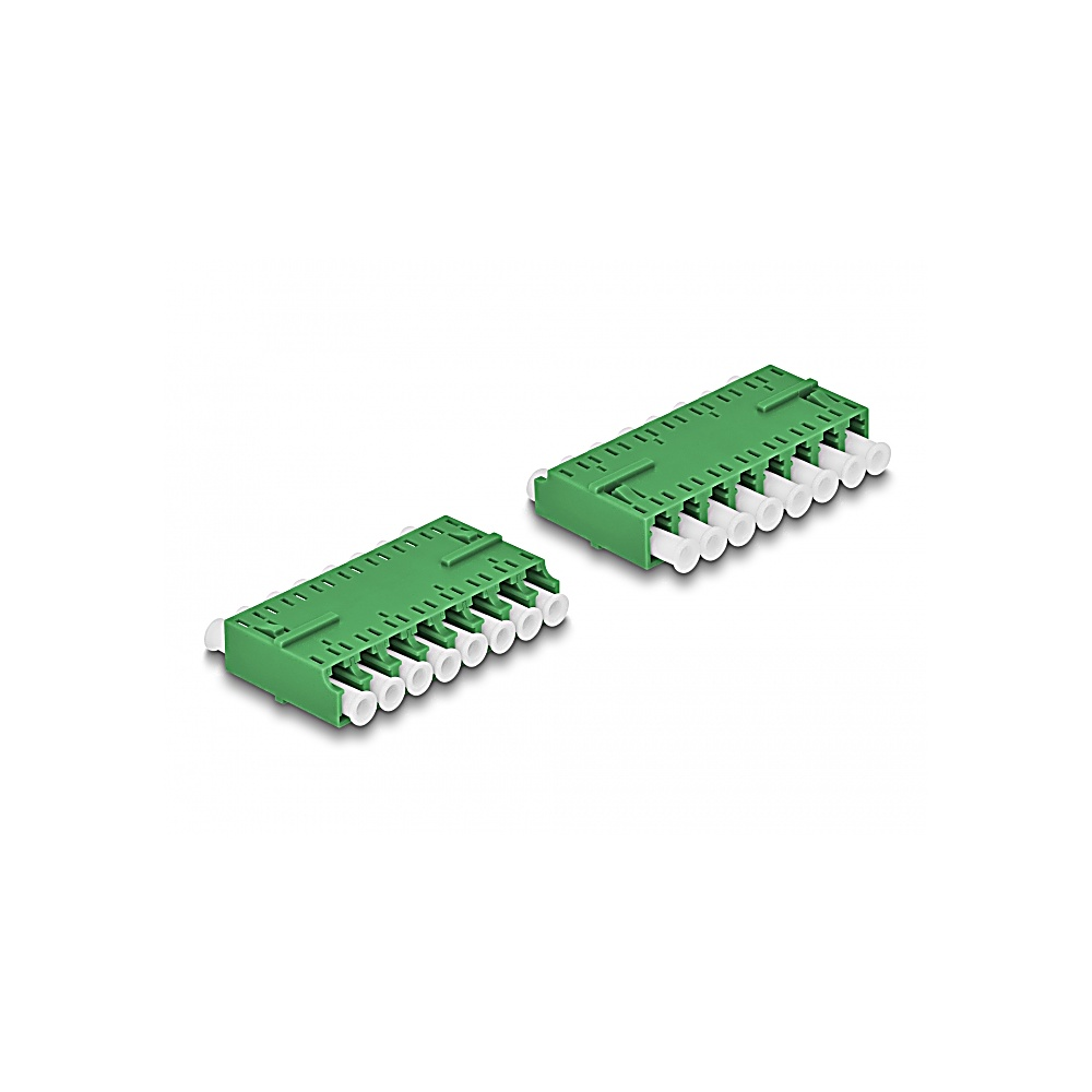Due componenti elettronici verdi con connettori bianchi su una superficie bianca. Sembrano dispositivi di rete.