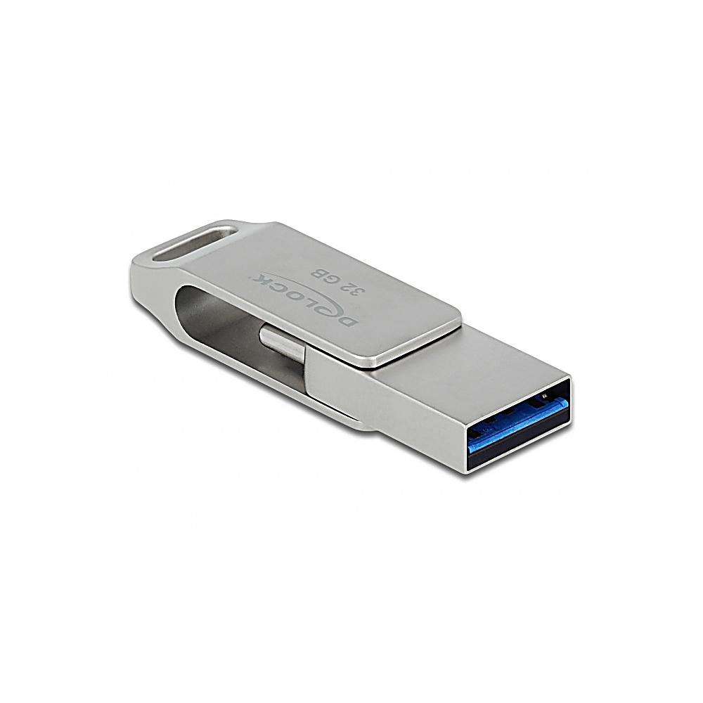 Srebrny pendrive USB. Dysk ma kształt prostokąta z niebieskim złączem USB. Etykieta mówi '32 GB' i 'Delock'.