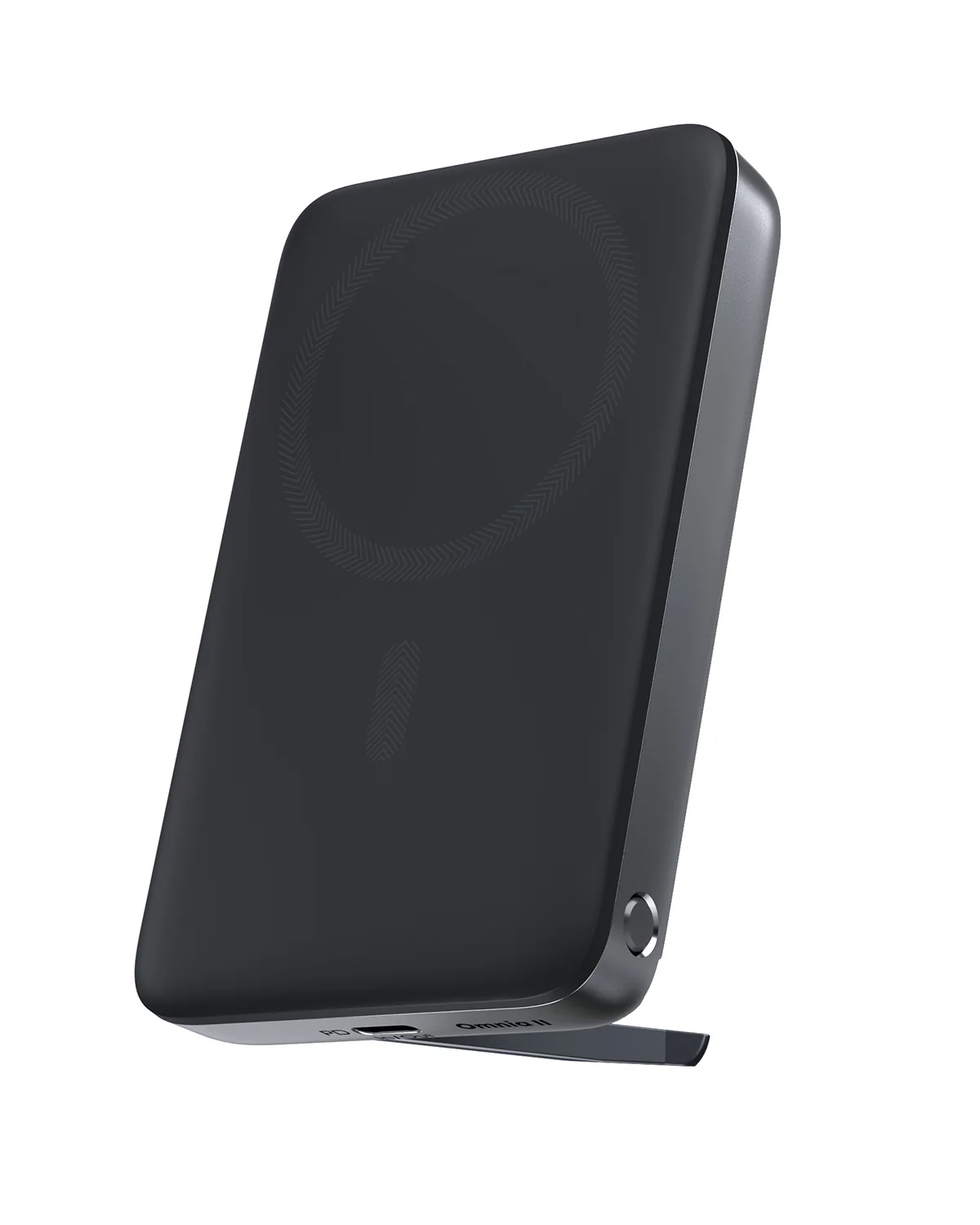 Un caricabatterie wireless nero con cornice argentata è appoggiato. Ha un'area di ricarica circolare e un piccolo supporto.