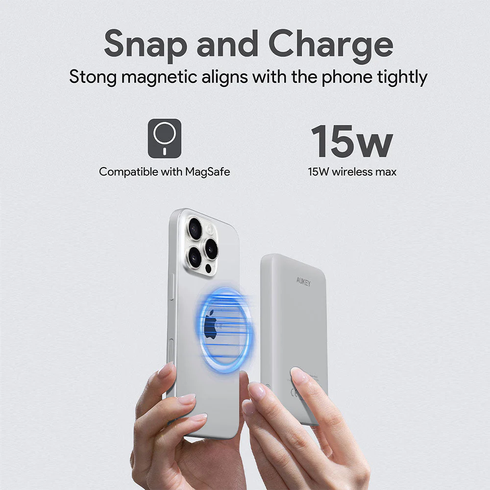 Una mano sostiene un teléfono y un cargador. La luz azul muestra la alineación magnética. Texto: Snap and Charge, Compatible con MagSafe, 15W wireless max.