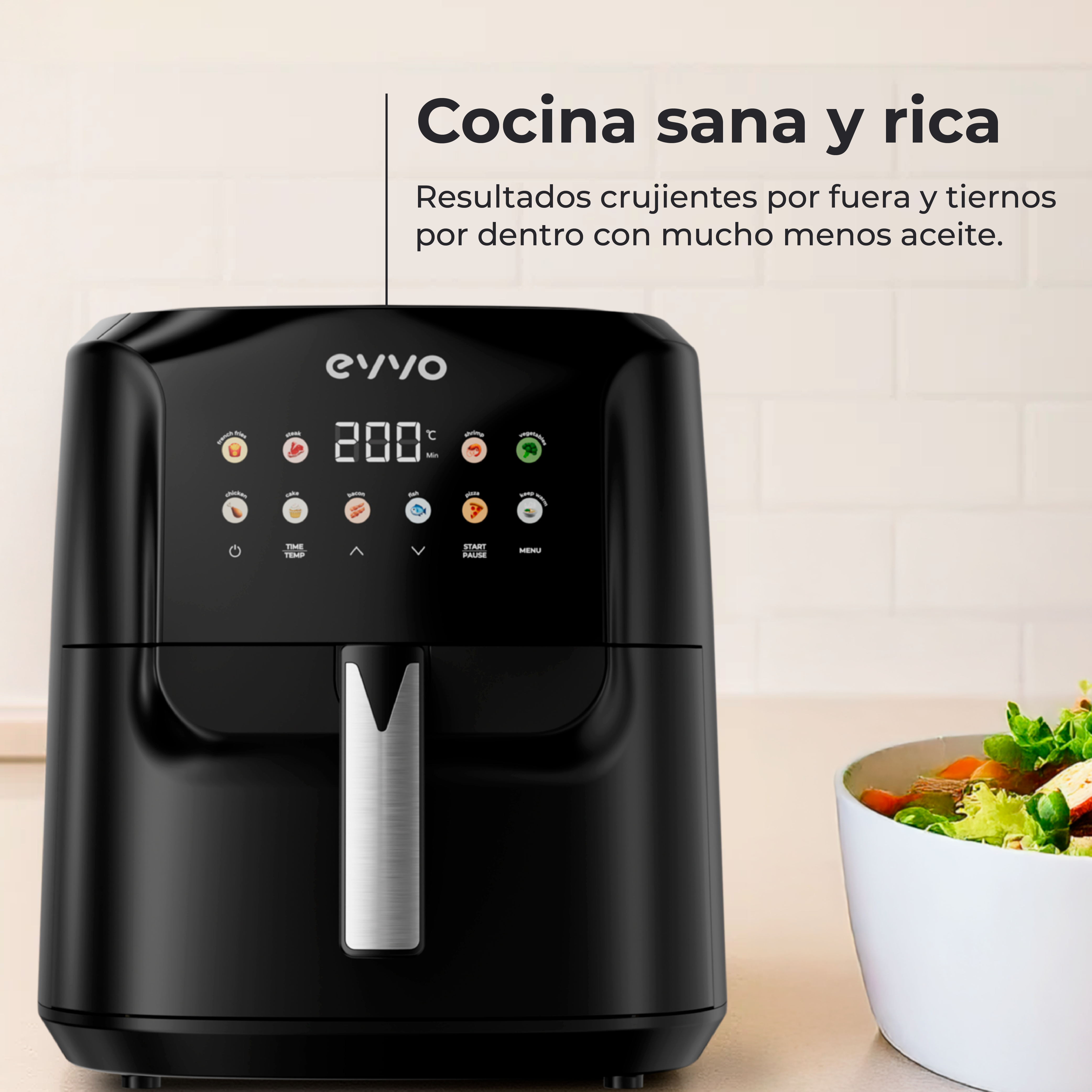 Freidora de aire negra con pantalla digital. Cuenco blanco con ensalada a la derecha. El texto indica cocina saludable.