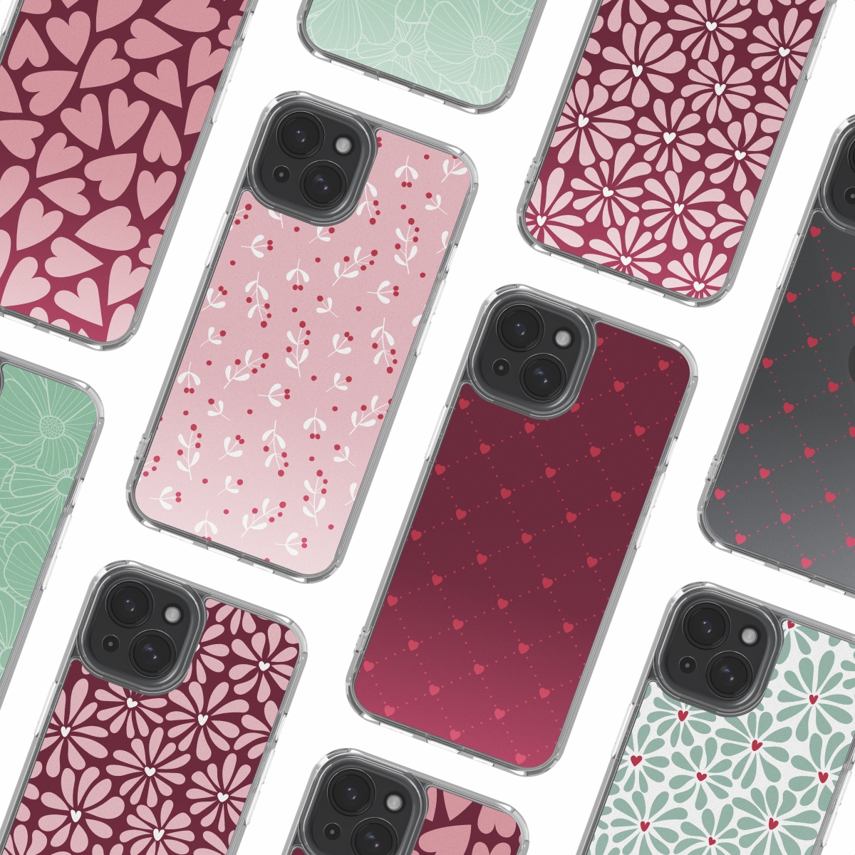 Several smartphones in cases with different patterns: hearts, flowers, and leaves. Cases have clear borders. Background is white.