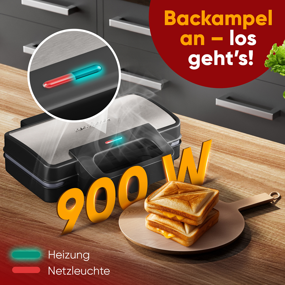 Ein Sandwichmaker mit getoastetem Sandwich, 900W-Text und einer rot/grünen Lichtanzeige. Backampel an - los geht's!
