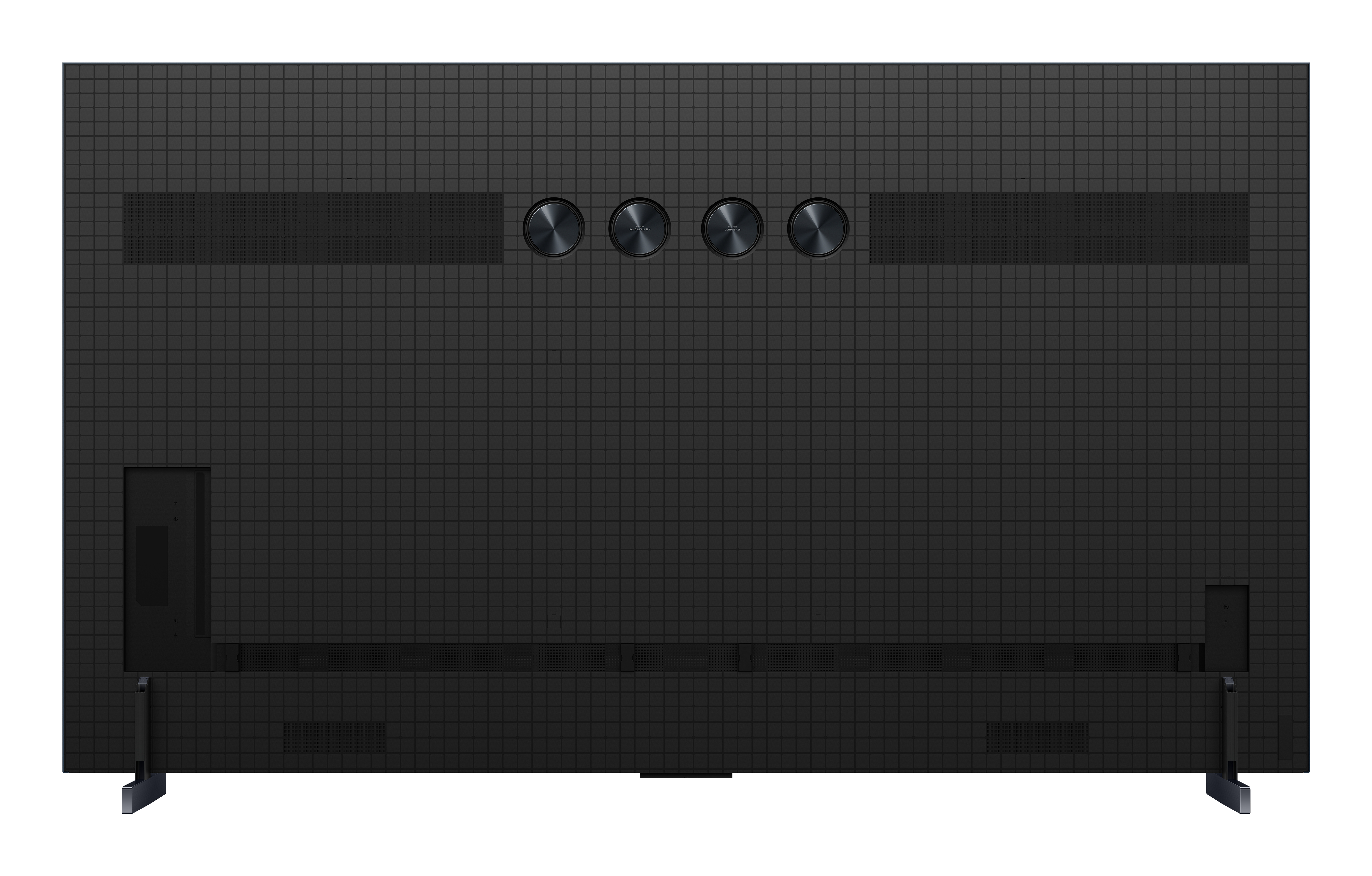 Tył czarnego telewizora. Ma wzorzystą powierzchnię. Są czarne przyciski i dwie nogi.