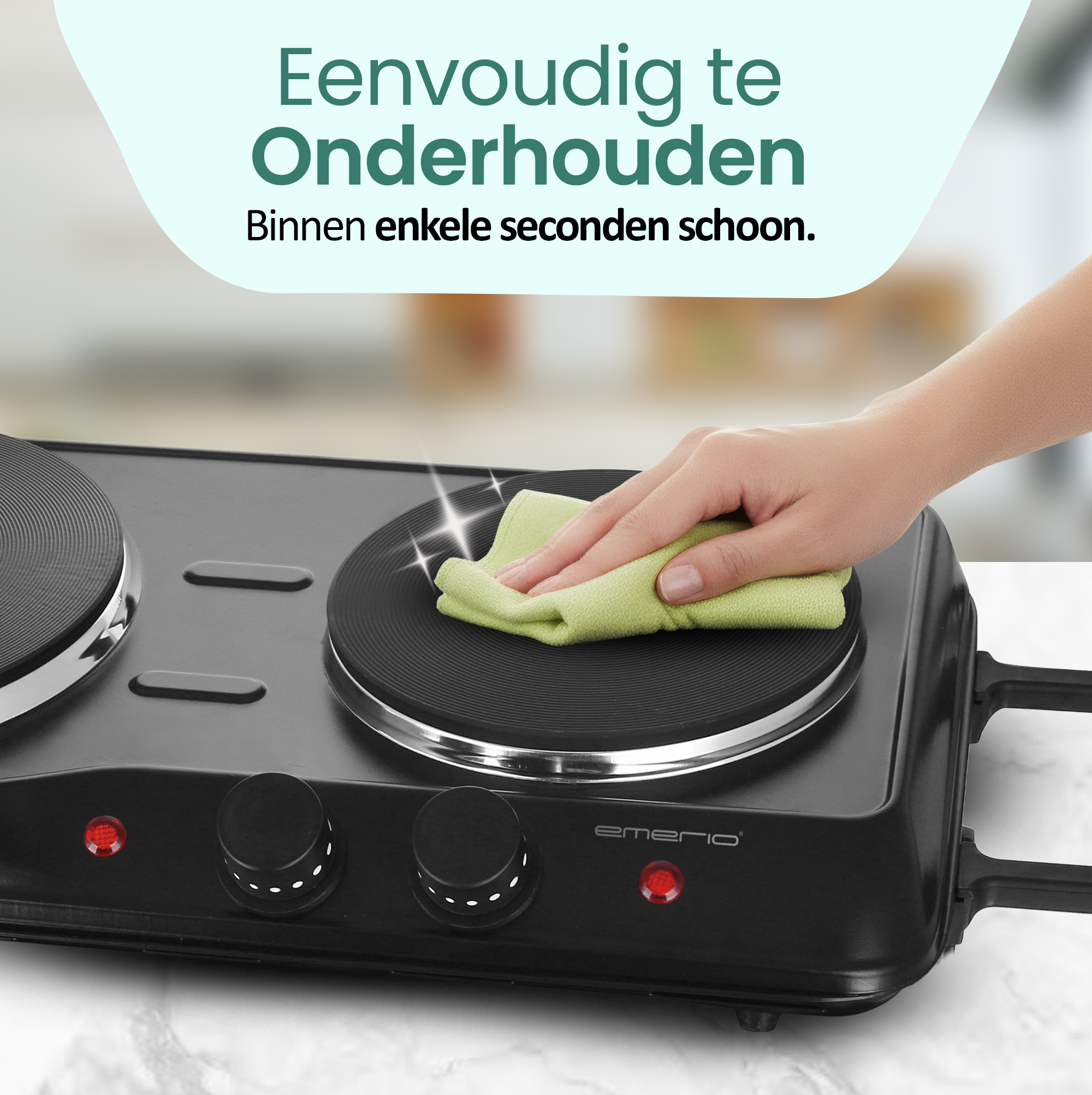 A hand wipes a black electric stove with a green cloth. The stove has two burners and control knobs.