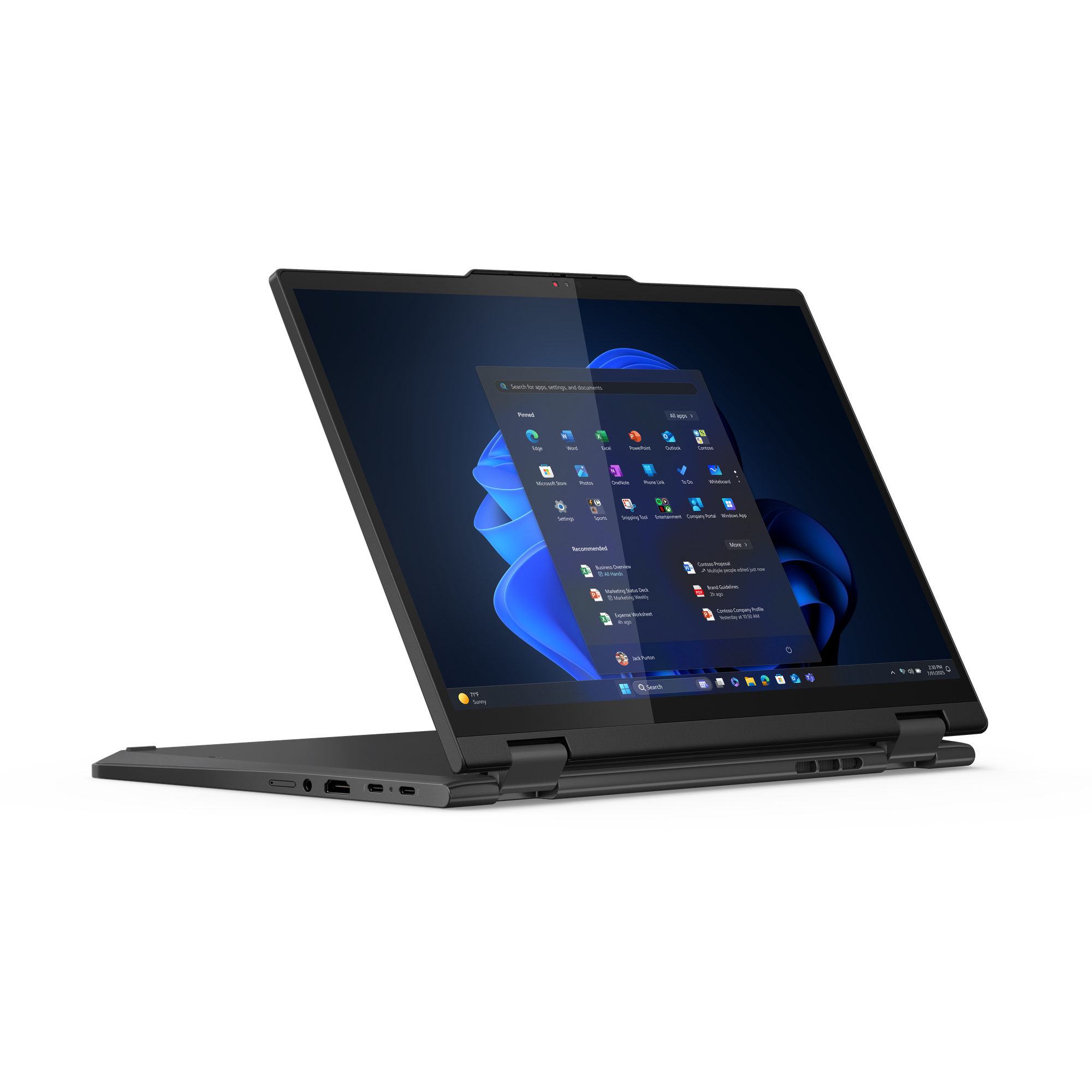 Un laptop nero è aperto, che mostra un'interfaccia Windows. Lo schermo mostra icone di app. Il laptop è su una superficie bianca.