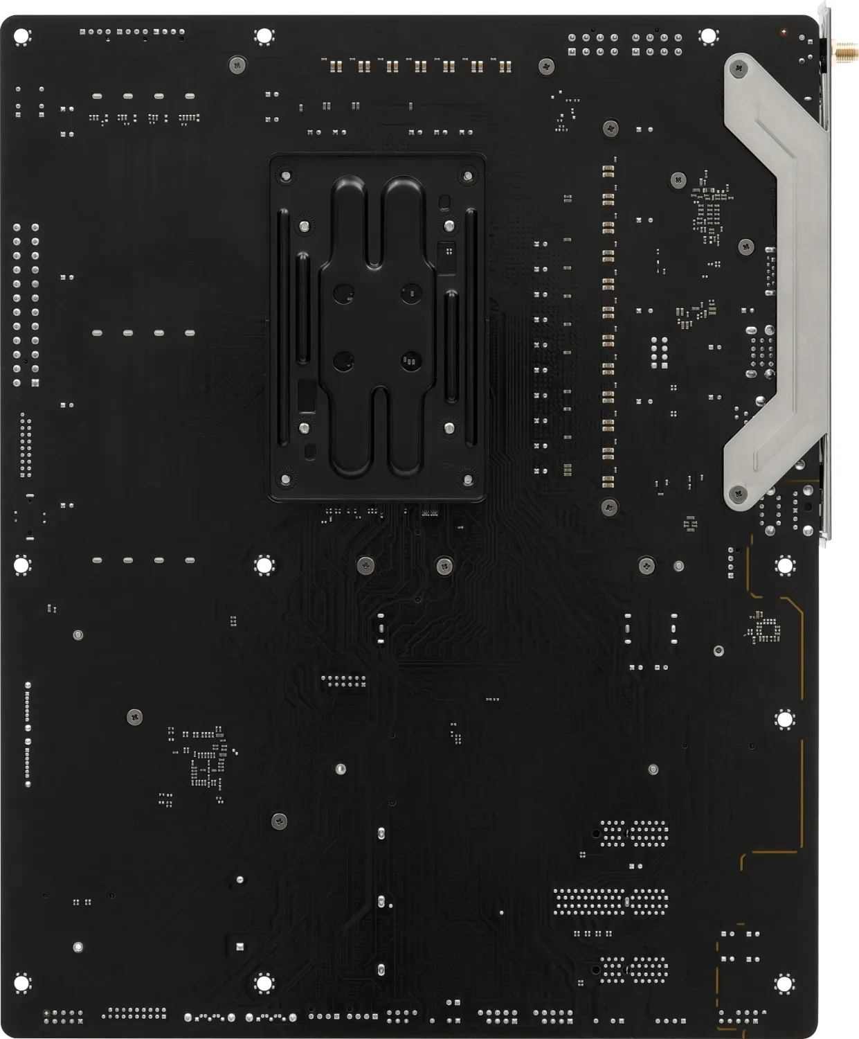 Une carte mère d'ordinateur noire avec des circuits et des composants. Elle possède un support métallique et divers points de montage.