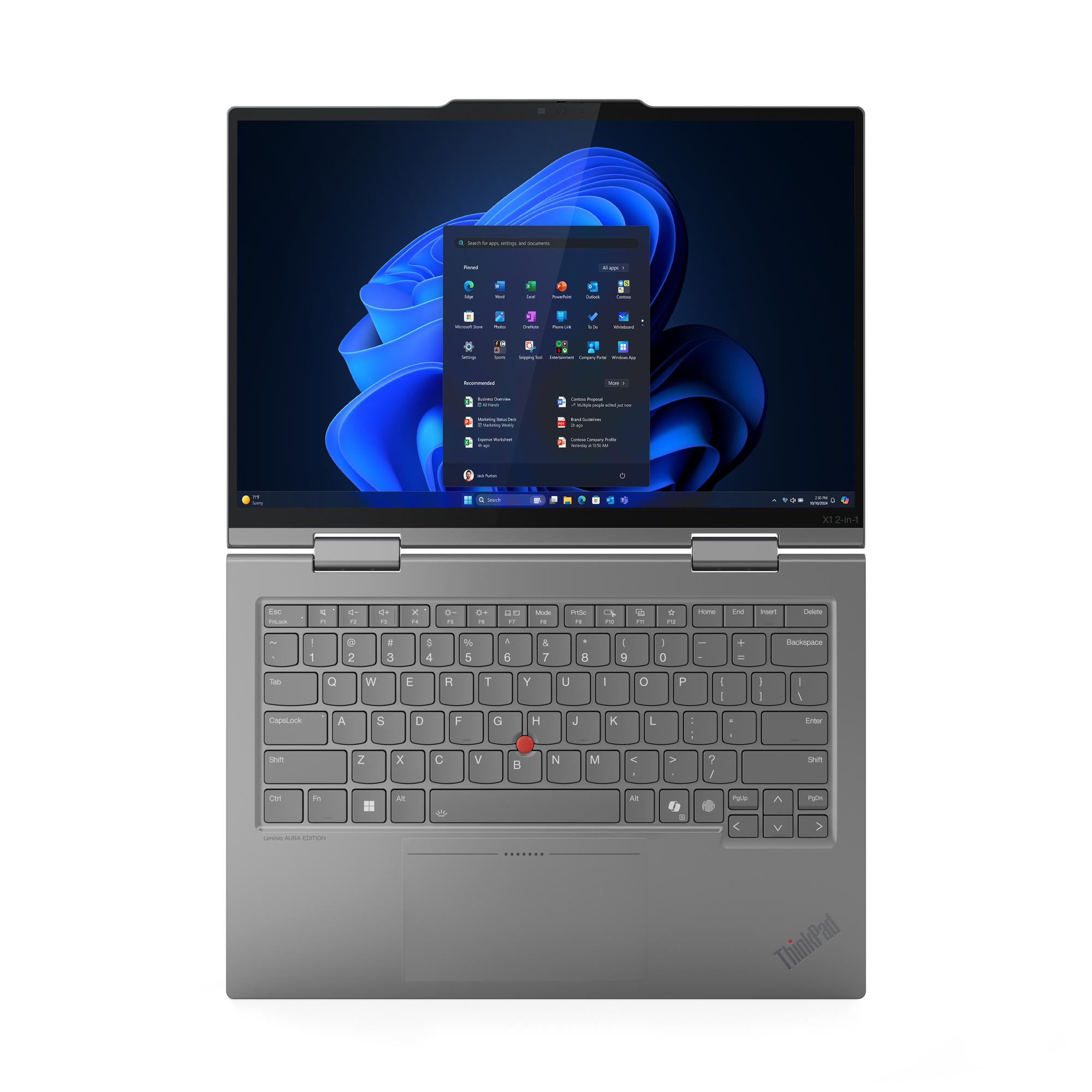 Un laptop ThinkPad grigio è aperto, con l'interfaccia di Windows 11. Tastiera in primo piano, schermo con applicazioni.