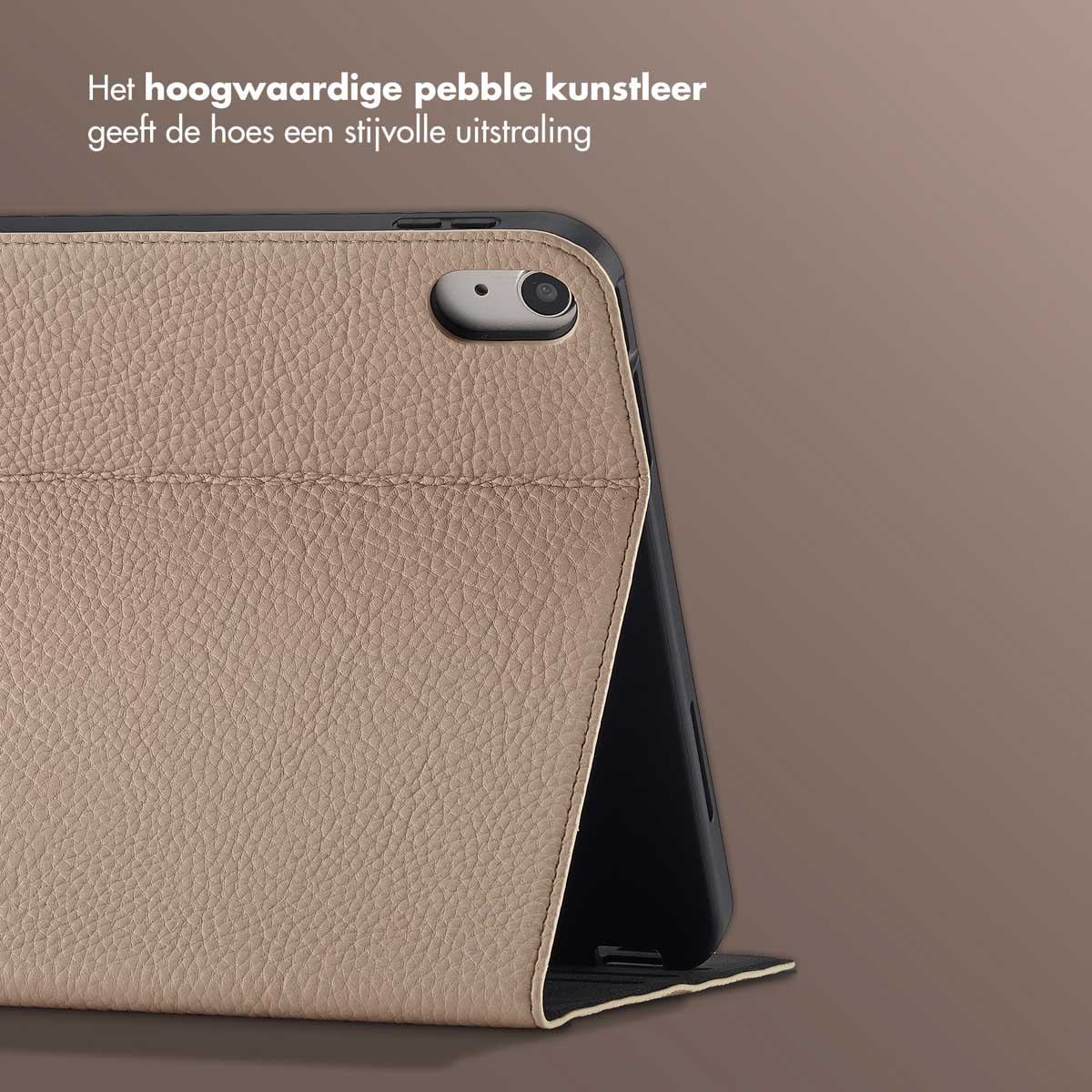A tan leather case with a camera on the side. The case surrounds a black device, set against a brown background.
