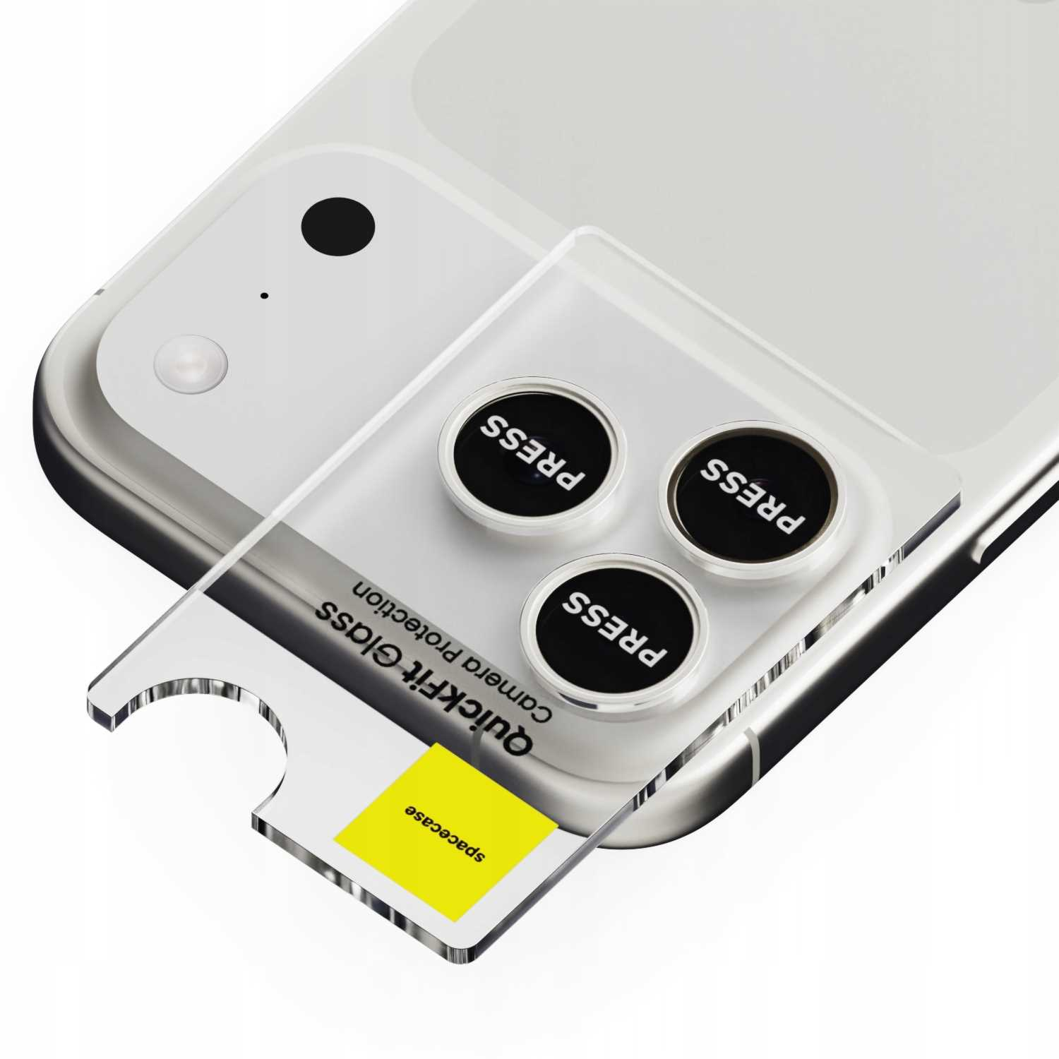 Telefon z przezroczystą osłoną aparatu, trzema czarnymi okręgami z napisem PRESS i żółtym kwadratem z tekstem.