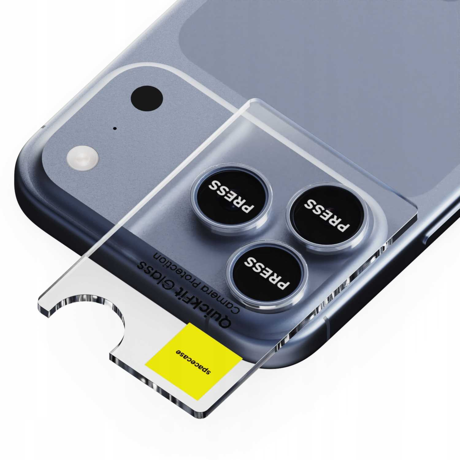 Telefon z osłonami na aparat. Przezroczyste szkło nad trzema czarnymi przyciskami z napisem 'PRESS'. Żółty kwadrat z tekstem 'spacecase'.