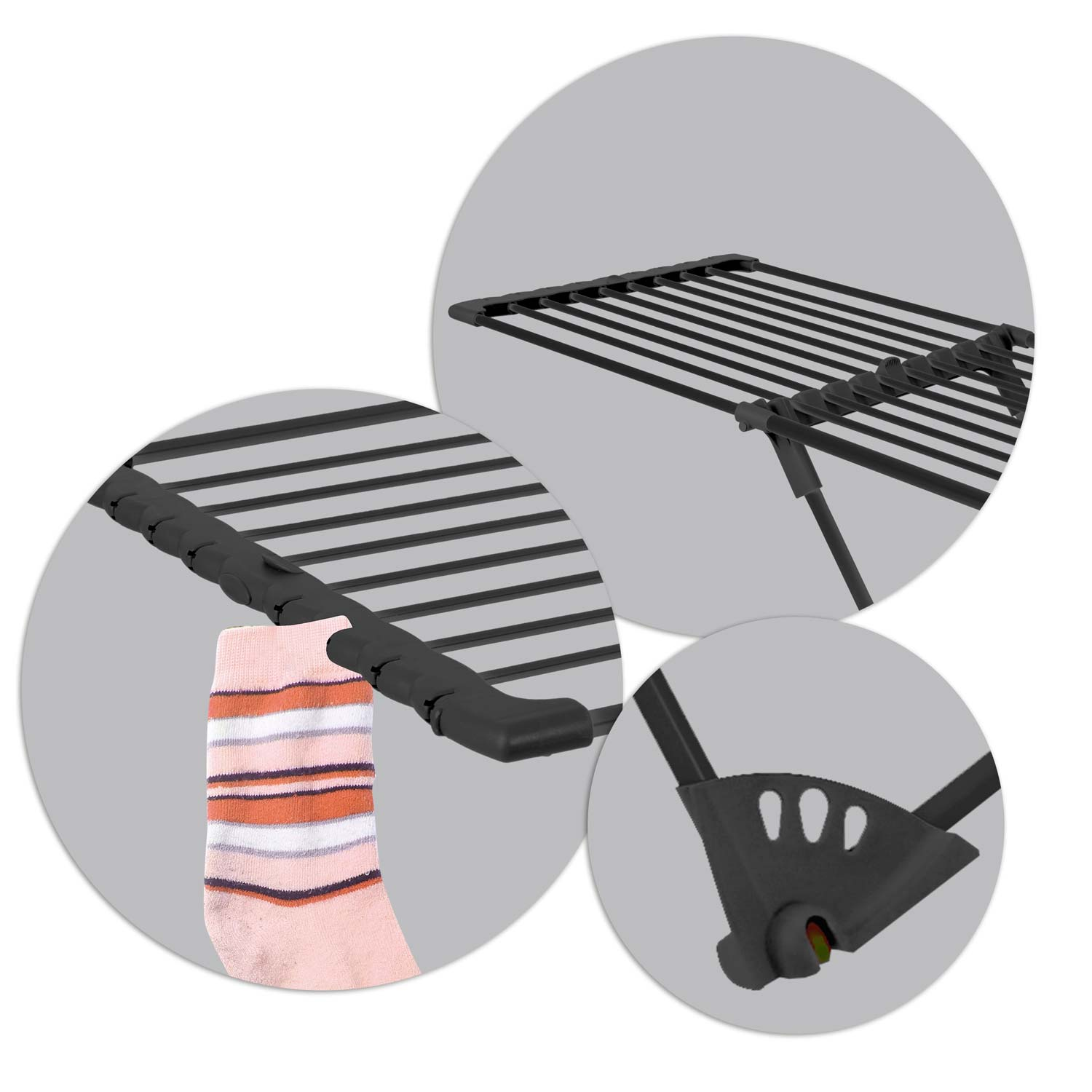 Czarny stojak do suszenia z wiszącą skarpetą. Skarpeta ma paski w kolorze pomarańczowym, białym i szarym.