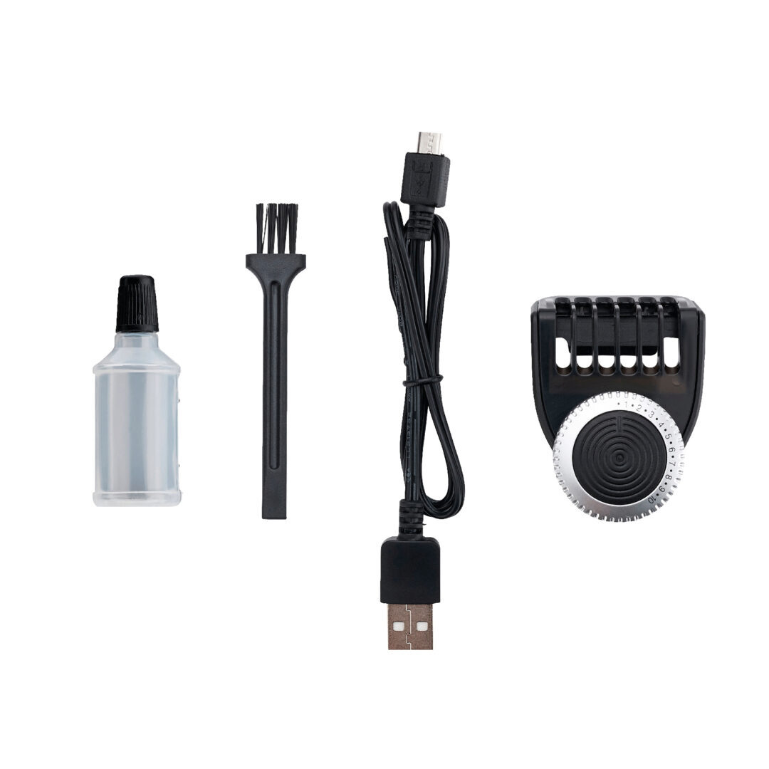 Juego de accesorios de aseo sobre blanco. Incluye botella, cepillo, cable USB y cabezal recortador.