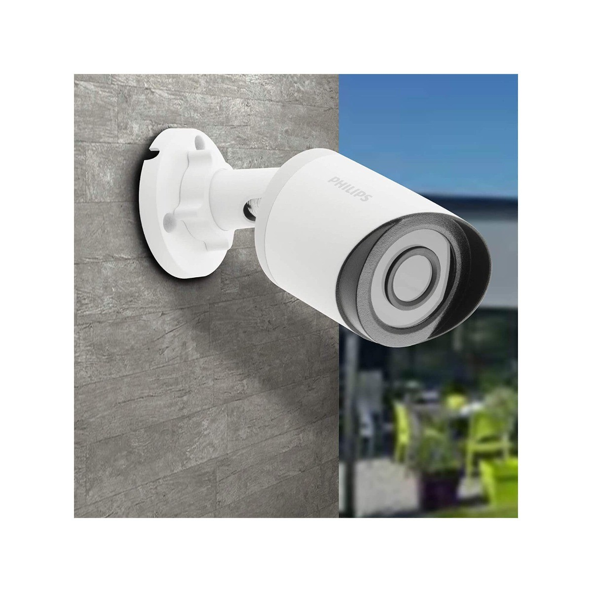 Cámara de seguridad Philips blanca montada en una pared de piedra gris, con fondo borroso. La cámara es cilíndrica.