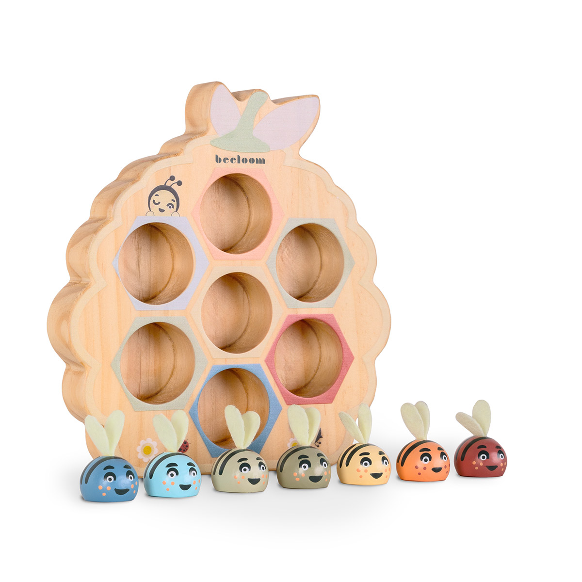 Juguete de madera con forma de panal y figuras de abejas de colores. Las abejas tienen diferentes colores. El panal tiene agujeros.