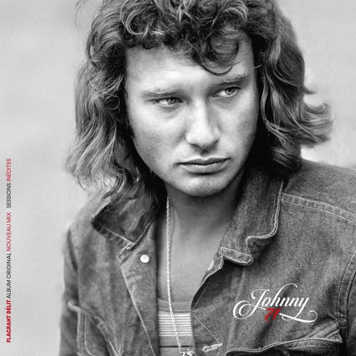Foto in bianco e nero di Johnny Hallyday. Indossa una giacca di jeans e guarda di lato. Titolo dell'album a sinistra.