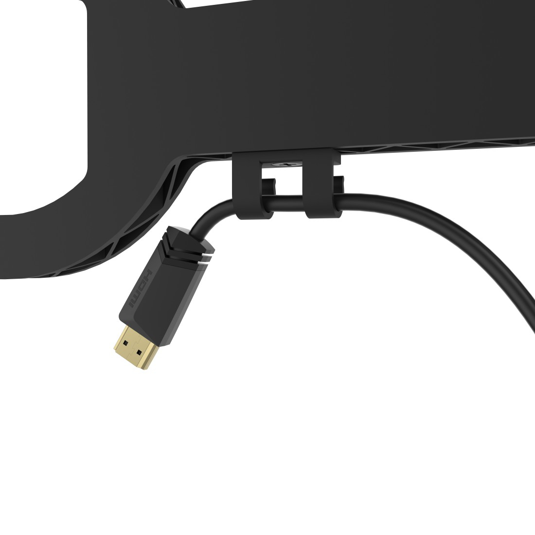 Czarny kabel HDMI jest podłączony do urządzenia. Kabel jest zabezpieczony czarnym klipsem. Białe tło.