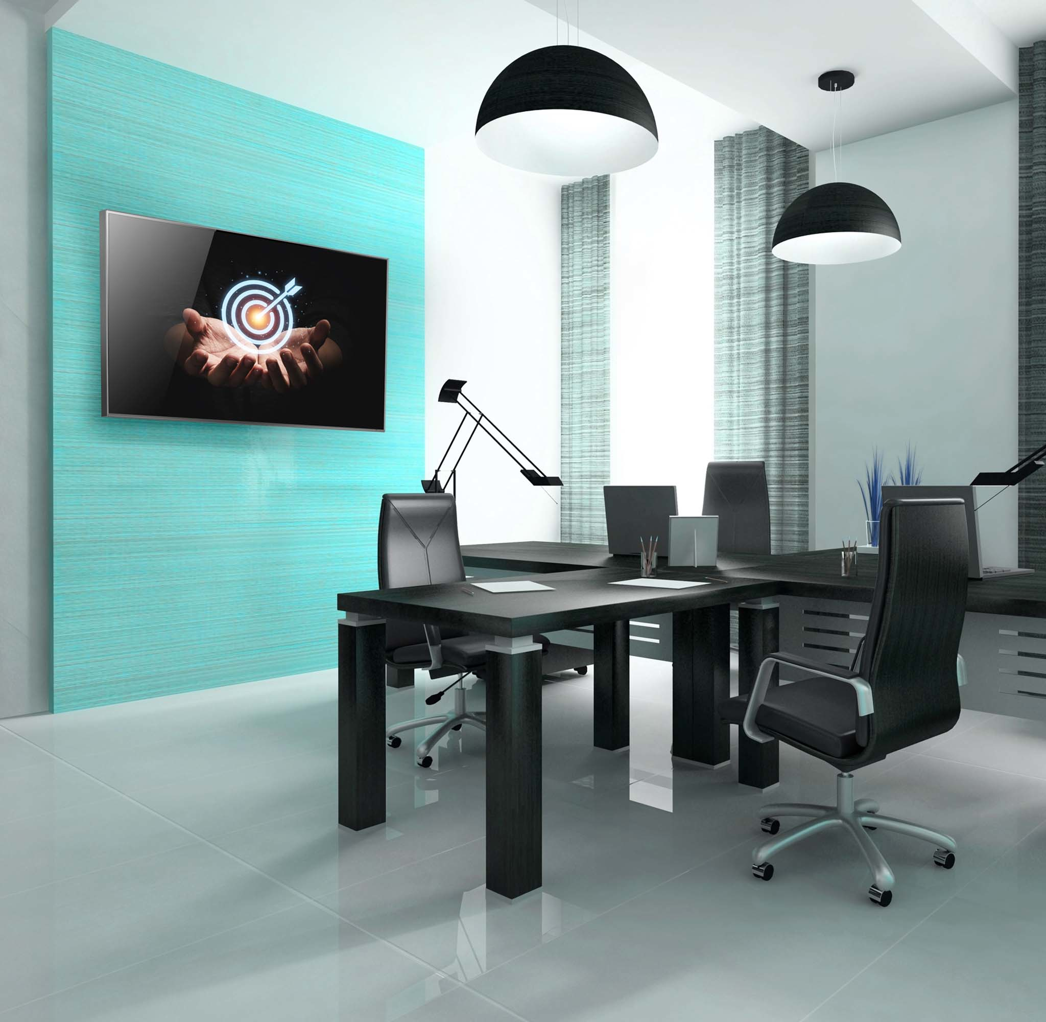 Bureau moderne avec bureaux, chaises et écran affichant une cible. Décor noir et blanc avec mur turquoise.