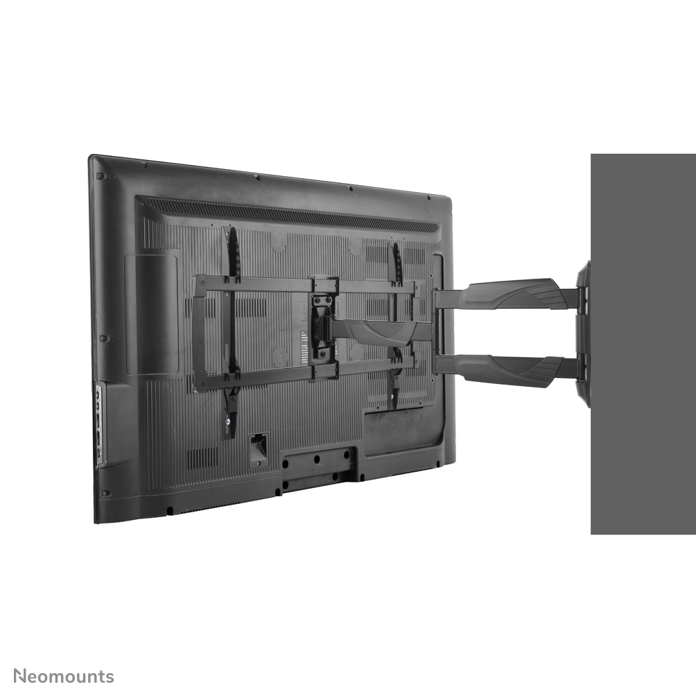 A large black TV is mounted on a wall with a black bracket. The TV is partially visible. The background is white.